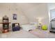 Bonus room with an arcade game, a treadmill, a bed, and a relaxing entertainment area at 2405 N Park Ave, Indianapolis, IN 46205