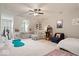 Large bonus room with a comfortable seating area, an arcade game, and plenty of open space at 2405 N Park Ave, Indianapolis, IN 46205