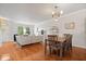 Open living space featuring hardwood floors, dining table, natural light and modern fixtures at 2405 N Park Ave, Indianapolis, IN 46205