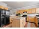 Spacious kitchen featuring stainless steel appliances, wooden cabinets and a central island at 2405 N Park Ave, Indianapolis, IN 46205