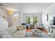 Bright living room featuring hardwood floors, neutral paint, windows and lots of natural light at 2405 N Park Ave, Indianapolis, IN 46205