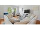 Spacious living room features hardwood floors, neutral paint, media center and natural light at 2405 N Park Ave, Indianapolis, IN 46205