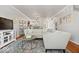 Open concept living room featuring hardwood floors, modern chandelier and neutral paint at 2405 N Park Ave, Indianapolis, IN 46205