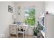 Bright home office with a white desk, shelving, and natural light at 2405 N Park Ave, Indianapolis, IN 46205