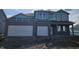Two-story home showing the 2-car garage and covered entry; construction in progress at 2684 Nampa Dr, Whitestown, IN 46075