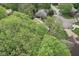 An aerial view of a lushly landscaped neighborhood, mature trees, and well-maintained homes at 2884 Brook Vista Dr, Carmel, IN 46032