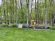 Backyard featuring a playset, playground, play area and a fire pit at 2884 Brook Vista Dr, Carmel, IN 46032