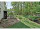 Outdoor space featuring mature trees, a patio and an outdoor dining area at 2884 Brook Vista Dr, Carmel, IN 46032