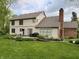 Backyard with a patio, outdoor dining set, grill and landscaped garden beds at 2884 Brook Vista Dr, Carmel, IN 46032