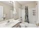 Traditional bathroom featuring a tub-shower combo and a white vanity at 2884 Brook Vista Dr, Carmel, IN 46032