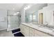 Elegant bathroom featuring a double sink vanity, soaking tub, and glass-enclosed shower at 2884 Brook Vista Dr, Carmel, IN 46032