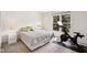 Bright bedroom with a cozy bed and a Peloton bike for at-home workouts at 2884 Brook Vista Dr, Carmel, IN 46032