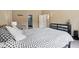 Spacious bedroom with a polka dot bedspread, lounge chair, and walk-in closet access at 2884 Brook Vista Dr, Carmel, IN 46032