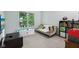 Cozy playroom features comfortable seating and plenty of space for playing at 2884 Brook Vista Dr, Carmel, IN 46032