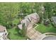 Stunning brick home boasts meticulous landscaping, mature trees, and attached two-car garage at 2884 Brook Vista Dr, Carmel, IN 46032