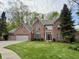 Beautiful two-story brick home with mature landscaping and a three car garage at 2884 Brook Vista Dr, Carmel, IN 46032