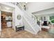 Welcoming foyer with tile flooring, a staircase, and an open view to the adjacent living spaces at 2884 Brook Vista Dr, Carmel, IN 46032