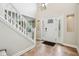 Bright foyer with a soaring ceiling, tile flooring, elegant staircase, and a front door with sidelights at 2884 Brook Vista Dr, Carmel, IN 46032