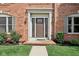 Inviting front entrance features a stylish front door, sidelights, and decorative lighting fixtures at 2884 Brook Vista Dr, Carmel, IN 46032