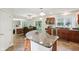 Open kitchen featuring a granite island, stainless steel appliances, and seamless flow to the dining area at 2884 Brook Vista Dr, Carmel, IN 46032