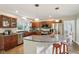 Well-lit kitchen with granite countertops, stainless steel appliances, and ample cabinet space for storage at 2884 Brook Vista Dr, Carmel, IN 46032