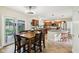 Spacious kitchen and eat-in dining area boasts wood cabinetry, granite countertops, and stainless steel appliances at 2884 Brook Vista Dr, Carmel, IN 46032