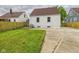 View of the backyard, featuring well-maintained lawn, side of the house, and a fence at 2908 Fairview St, Anderson, IN 46016