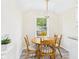 Cozy dining area featuring a round table, chandelier, and natural light creating a warm atmosphere at 2908 Fairview St, Anderson, IN 46016
