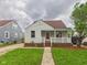 Charming home featuring a cozy front porch, well-maintained lawn, and classic architectural details at 2908 Fairview St, Anderson, IN 46016