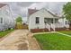 This home boasts a long driveway, a fenced yard, and charming curb appeal in a well-kept neighborhood at 2908 Fairview St, Anderson, IN 46016