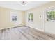 Cozy living room with a ceiling fan, neutral paint, and several windows allowing for an abundance of natural light at 2908 Fairview St, Anderson, IN 46016