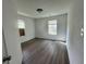 Neutral bedroom features new floors, fresh paint, and natural light from the windows at 3114 Adams St, Indianapolis, IN 46218