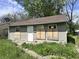 Shows the front yard and exterior of this single Gathering home at 3114 Adams St, Indianapolis, IN 46218