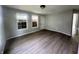 Inviting living room with laminate flooring, neutral walls, and natural light from two windows at 3114 Adams St, Indianapolis, IN 46218