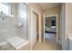 Modern bathroom featuring a glass shower, built-in bench, access to the toilet, and a glimpse into the bedroom at 345 Ehrlich Ln, Westfield, IN 46074