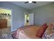 Comfortable bedroom showcasing a closet and doorway leading to another room with neutral wall paint and carpet at 345 Ehrlich Ln, Westfield, IN 46074