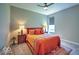 Cozy bedroom featuring a ceiling fan, a window, and an elegant bed with decorative pillows and a patterned rug at 345 Ehrlich Ln, Westfield, IN 46074