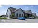 Modern clubhouse exterior featuring sleek architecture, ample parking, and manicured landscaping at 345 Ehrlich Ln, Westfield, IN 46074