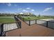 Scenic deck overlooking a tranquil pond with a fountain, providing a relaxing community space at 345 Ehrlich Ln, Westfield, IN 46074