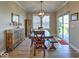 Inviting dining room with a farmhouse-style table, bench seating, and a sliding glass door leading to the patio at 345 Ehrlich Ln, Westfield, IN 46074