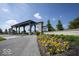 Community entrance featuring decorative landscaping, a pergola-covered entryway, and a welcoming neighborhood at 345 Ehrlich Ln, Westfield, IN 46074