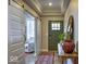 Welcoming entryway featuring sliding barn doors, wood floors, and a decorative table at 345 Ehrlich Ln, Westfield, IN 46074