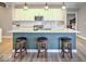Well-appointed kitchen island with seating, stainless steel appliances, white cabinets, and modern pendant lights at 345 Ehrlich Ln, Westfield, IN 46074