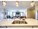 Open-concept kitchen showcasing an island with a sink, stainless steel appliances, and a view into the living room at 345 Ehrlich Ln, Westfield, IN 46074