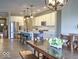 Bright kitchen with stainless steel appliances, white cabinets, and a center island with barstool seating at 345 Ehrlich Ln, Westfield, IN 46074