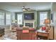 Inviting living room with a fireplace, large windows, and cozy seating arrangements at 345 Ehrlich Ln, Westfield, IN 46074