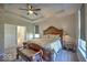 Spacious primary bedroom features tray ceilings, and bench at the foot of the bed, with natural light from two windows at 345 Ehrlich Ln, Westfield, IN 46074
