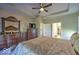 Expansive main bedroom features tray ceilings, an ornamented mirror, and a dresser with doorway to a bathroom at 345 Ehrlich Ln, Westfield, IN 46074