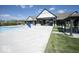 Inviting pool area with ample seating, well-maintained landscaping, and a modern clubhouse in the background at 345 Ehrlich Ln, Westfield, IN 46074