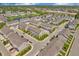 A wide aerial view of the neighborhood showcasing meticulously planned townhomes, greenery, and street layout at 3546 Brampton Ln, Westfield, IN 46074